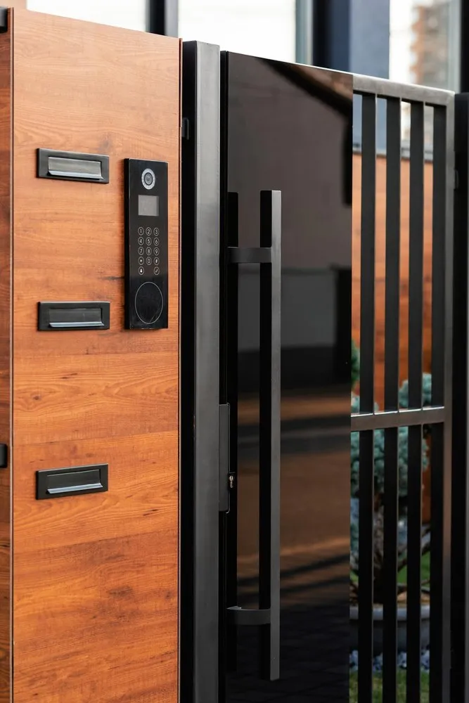 Smart lock and video doorbell on an Ozcan Group front door