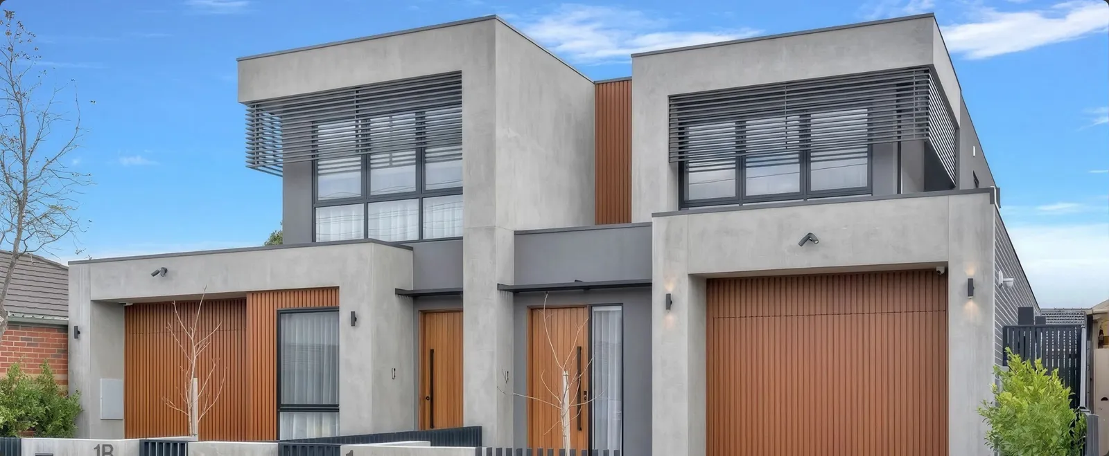 Street view of the Avondale Heights custom home's rendered facade with a timber garage door