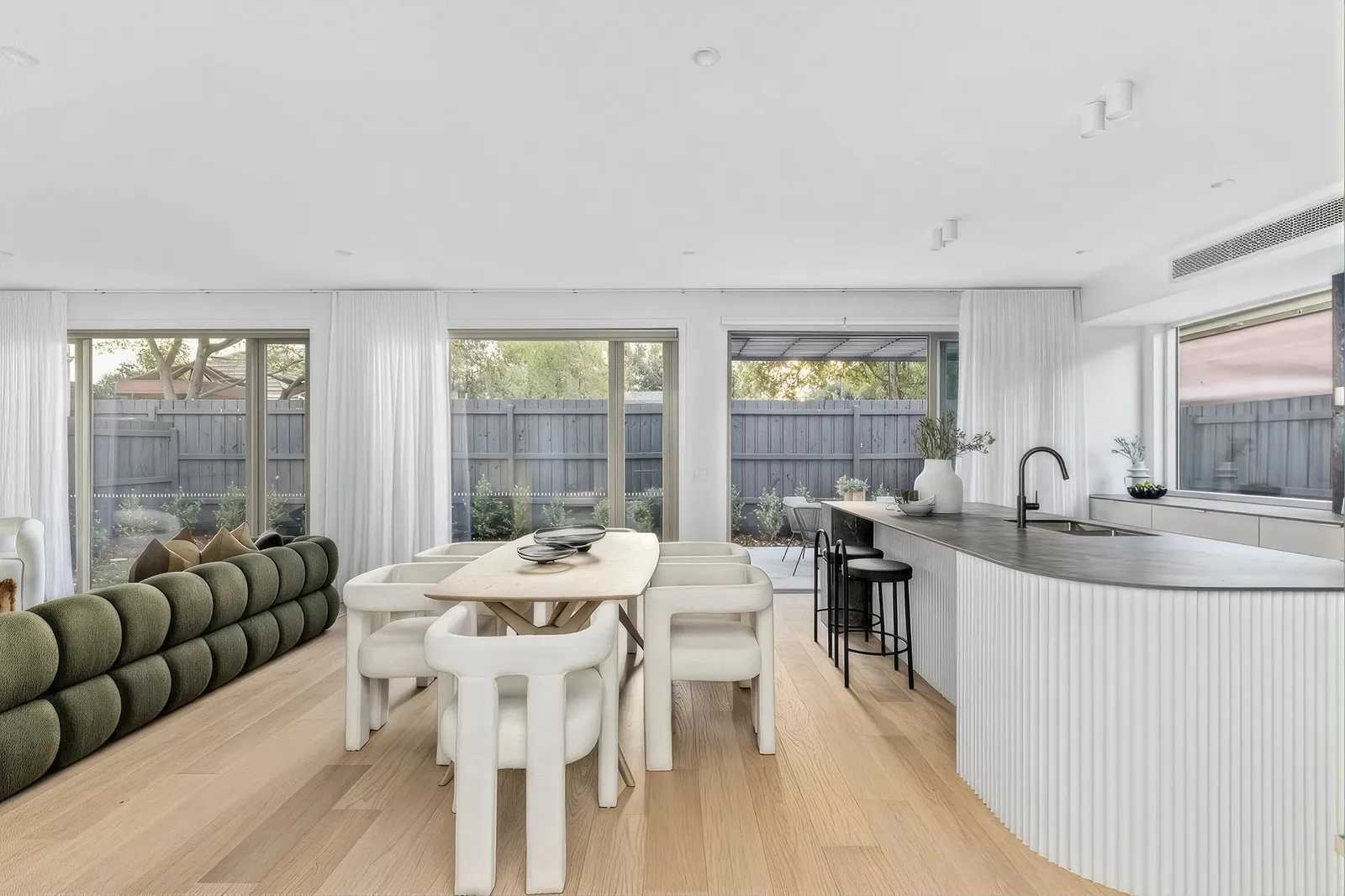 Open-plan living and kitchen in a Woorigoleen townhouse, Keilor East